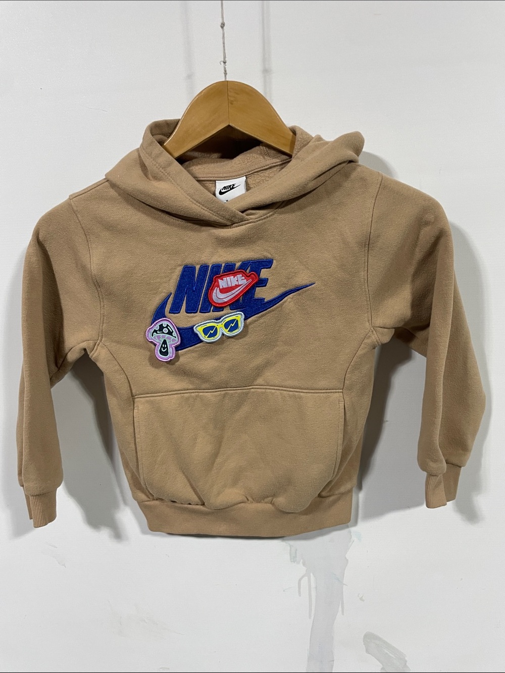 Nike Kids Beige Hoodie with Blue and Red Logo Patches